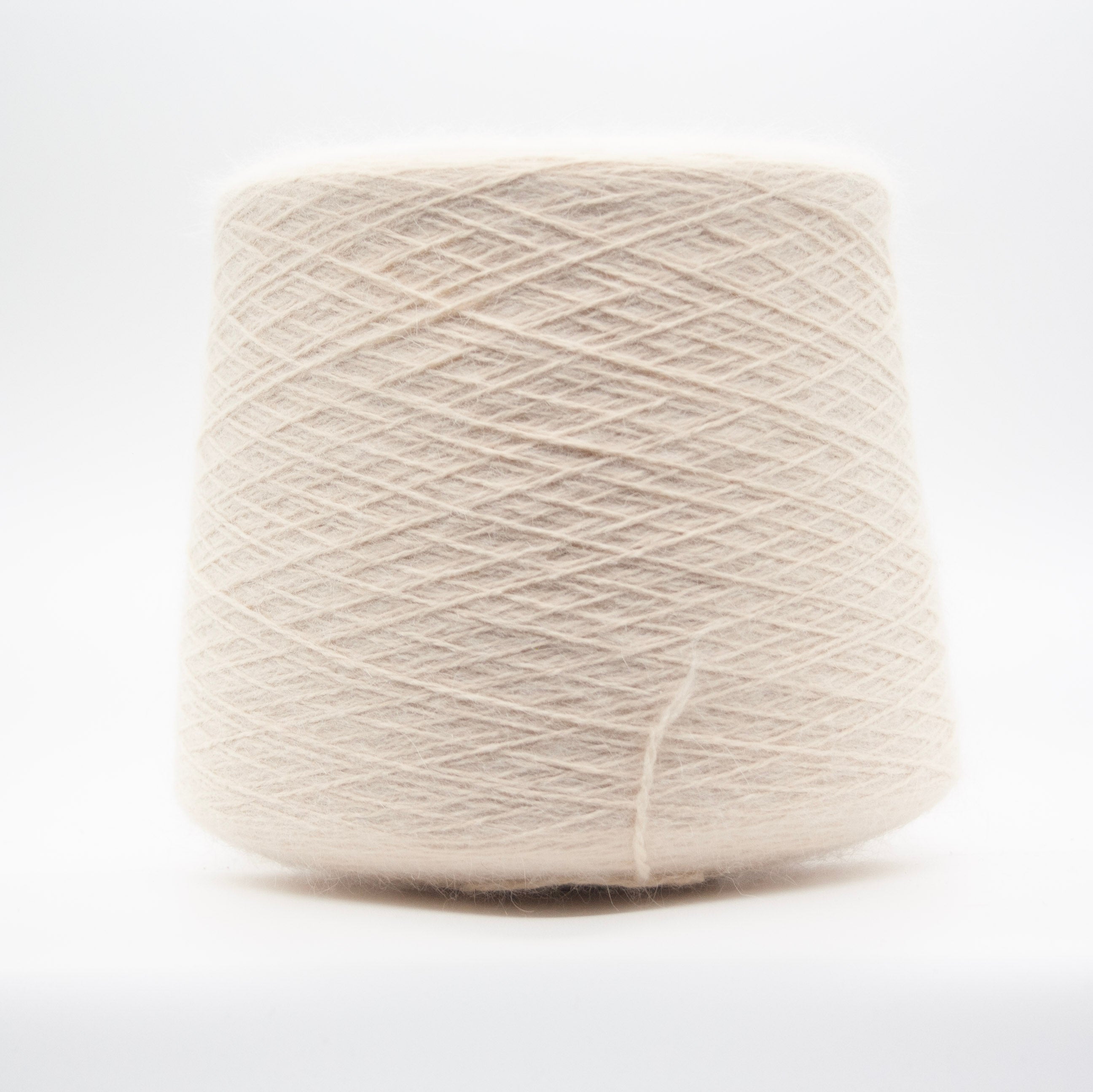 Cone of Angora 70 yarn in Modesto Ivory Mist by Filati Biagioli