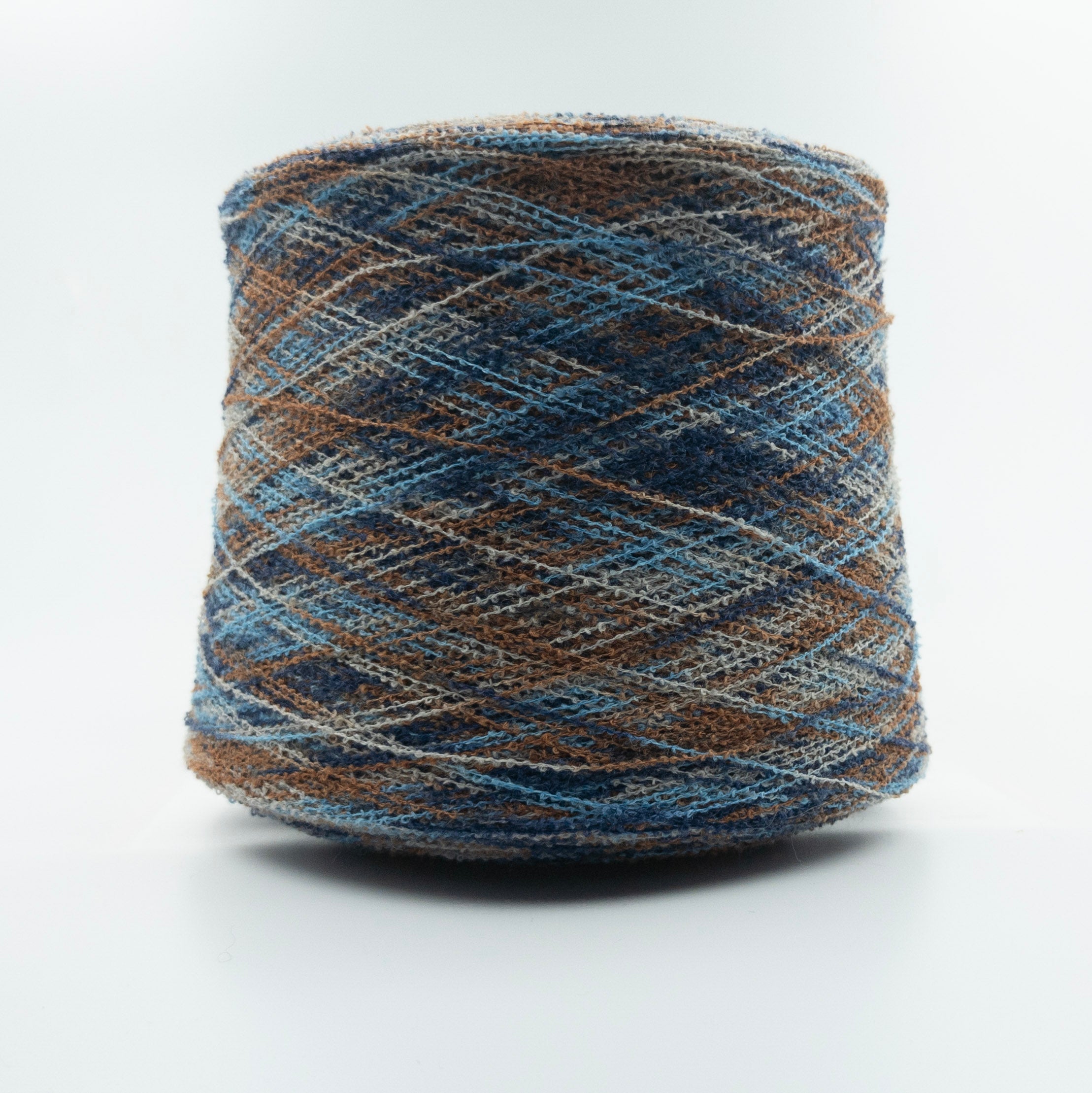 Cone of Chanel yarn in Blue Brown by Suedwolle Group