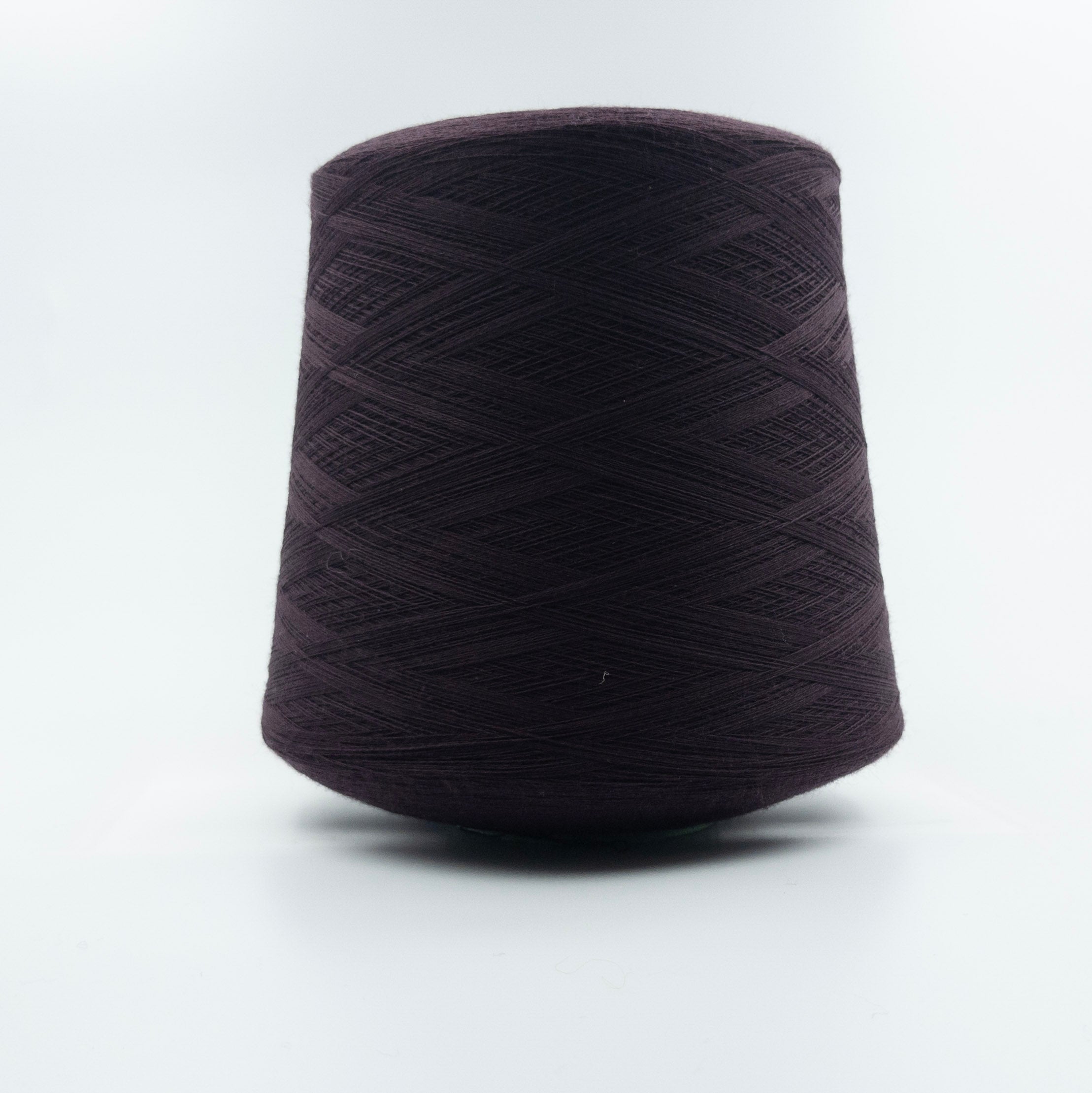 Cone of Concorde yarn in Bordeaux by Suedwolle Group