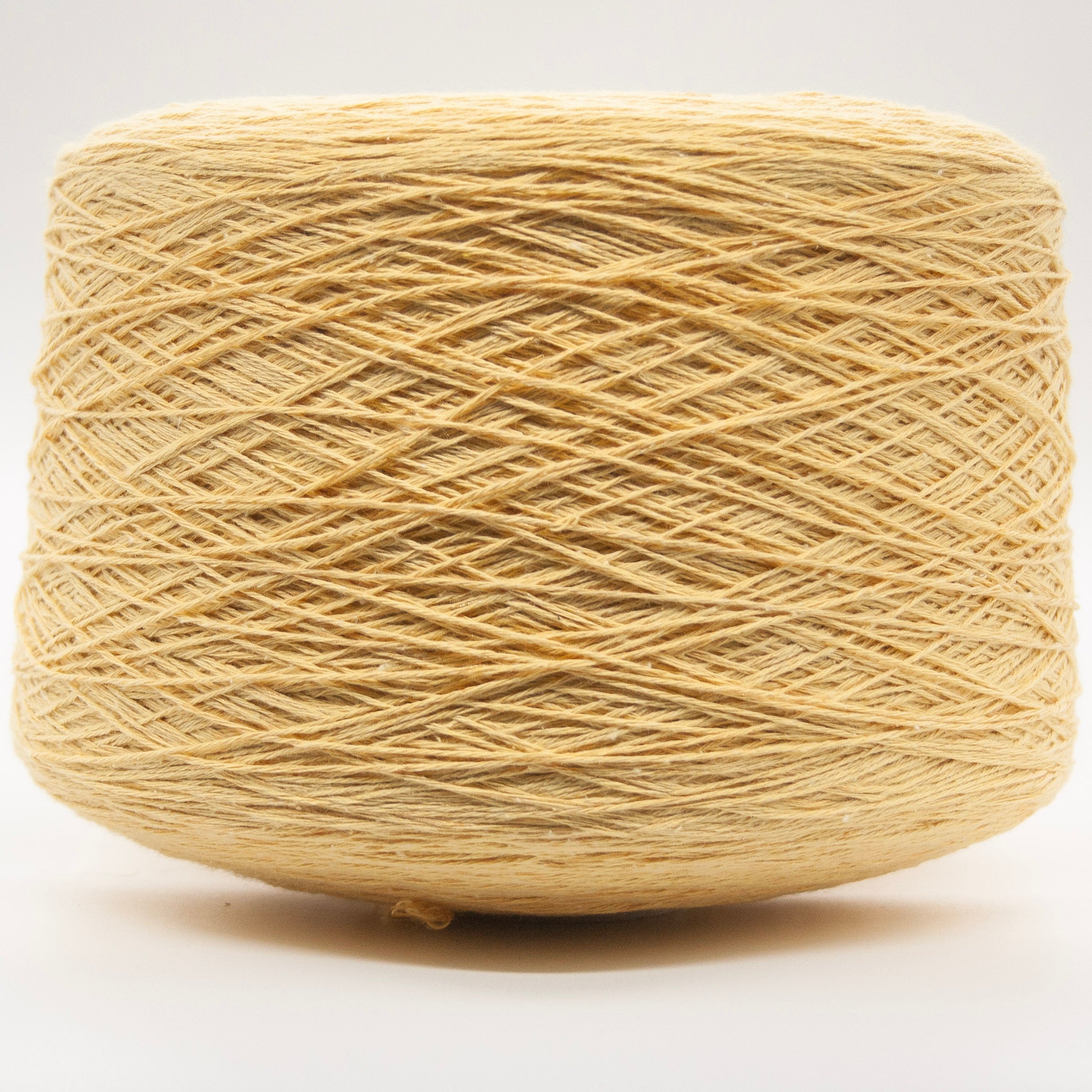 Cone of Cotton Gold yarn in Soft Gold by Filati Venezia