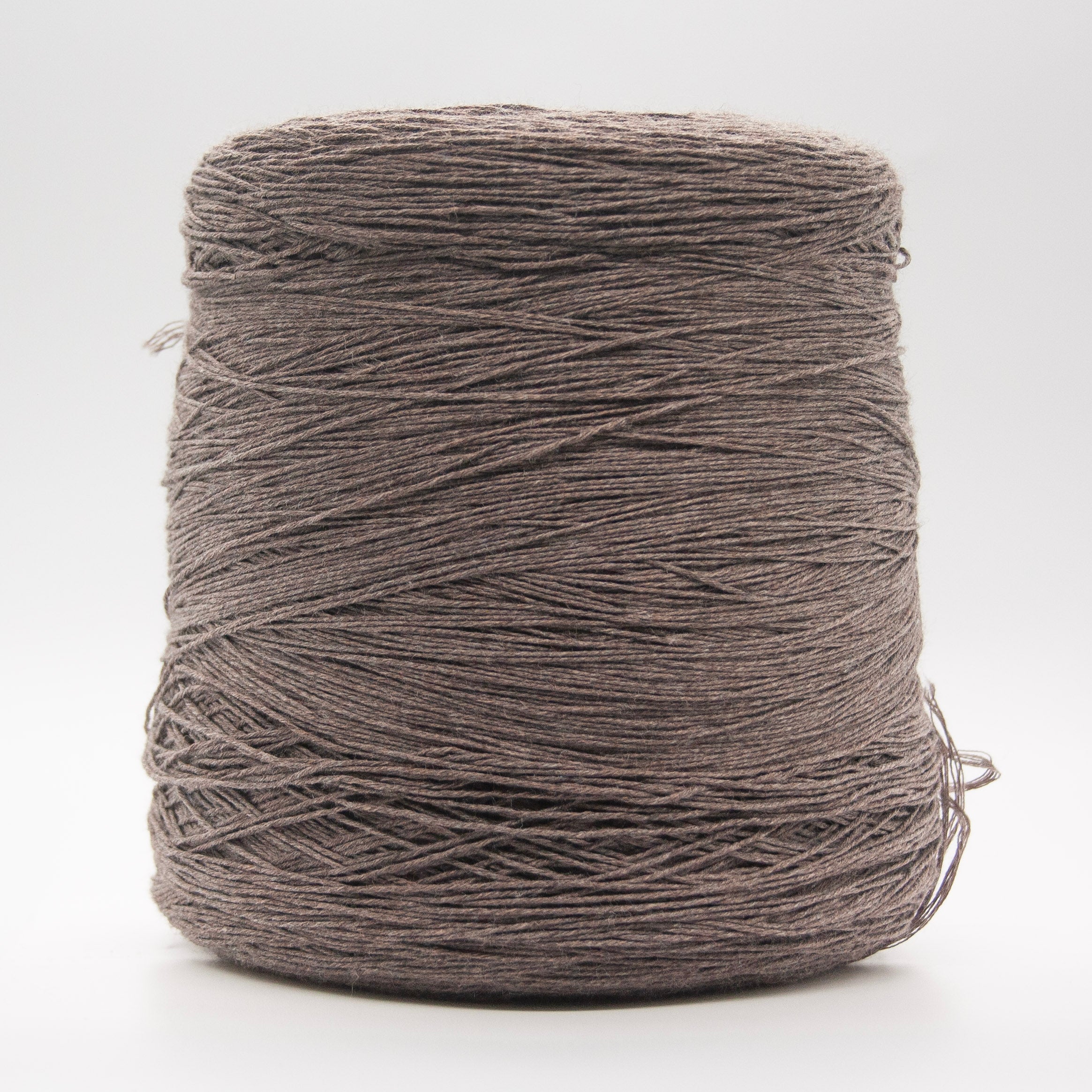 Cone of Plume yarn in Terra Ombra by Suedwolle Group