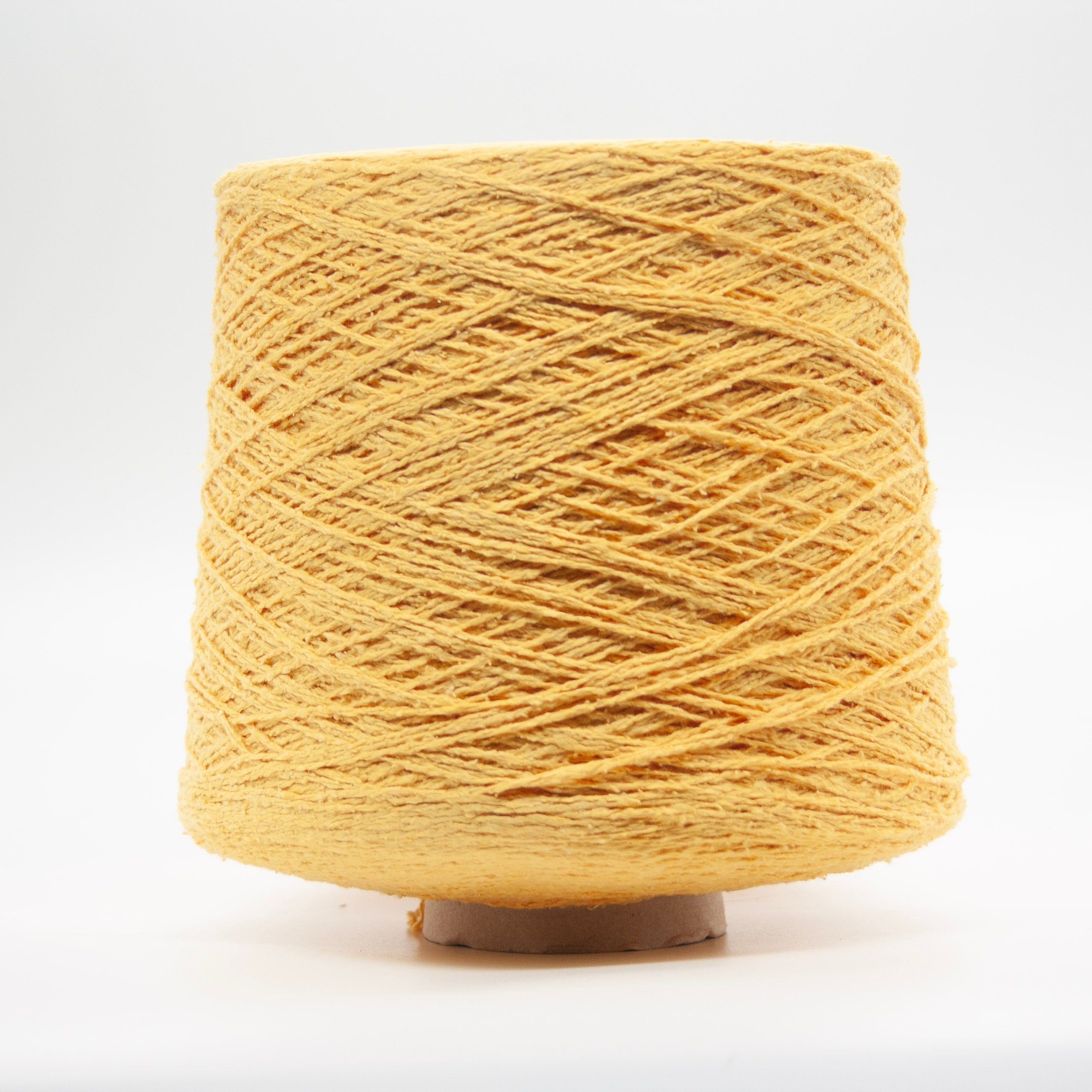Cone of Seta Bourette yarn in Burro Fresco by Filati Venezia