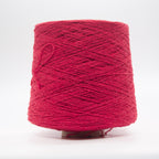 Cone of Seta Bourette yarn in Lampone Nero by Filati Venezia