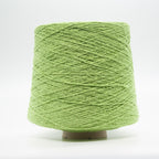 Cone of Seta Bourette yarn in Mela Verde by Filati Venezia