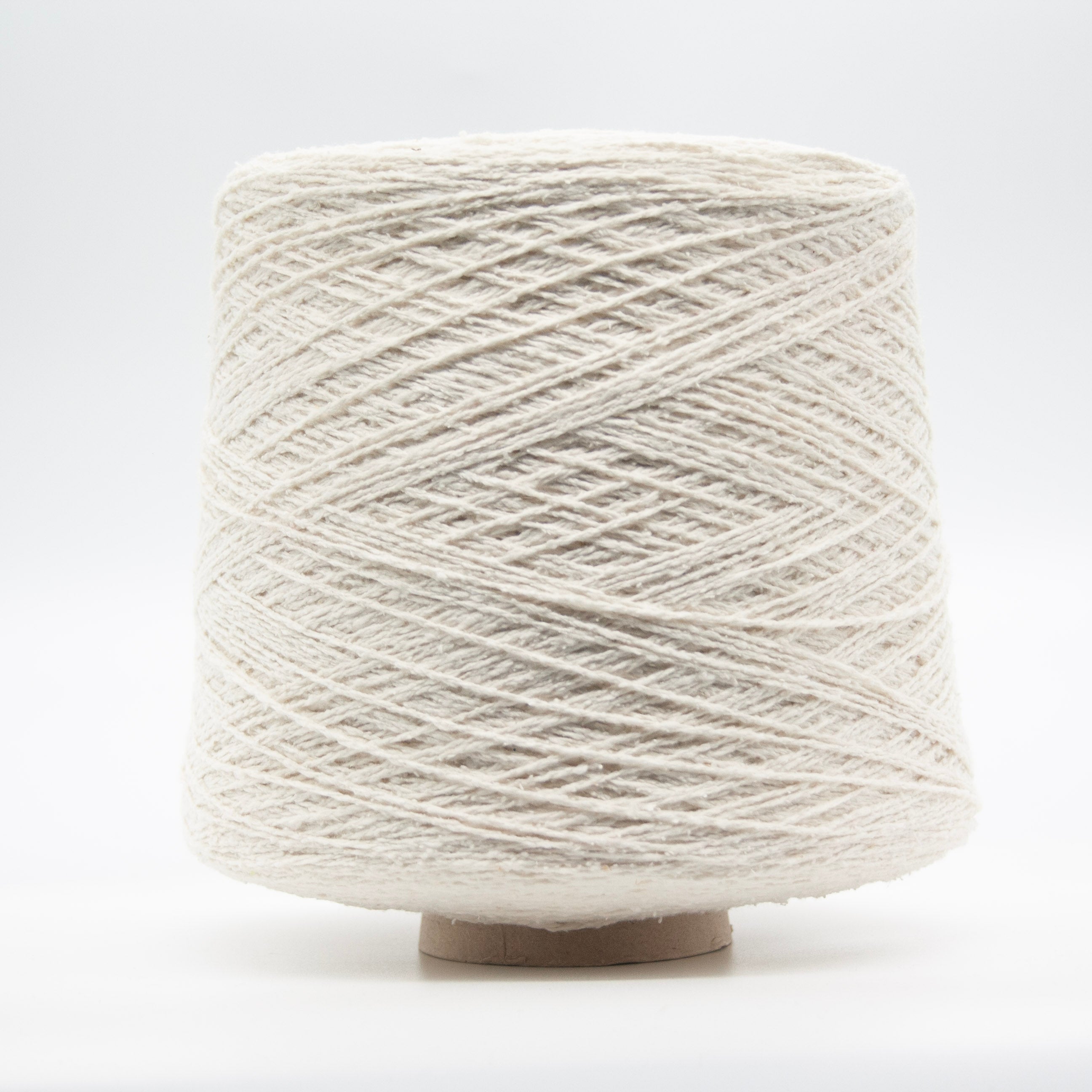 Cone of Seta Bourette yarn in Panna Antica by Filati Venezia