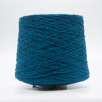 Cone of Seta Bourette yarn in Petrolio Blu by Filati Venezia