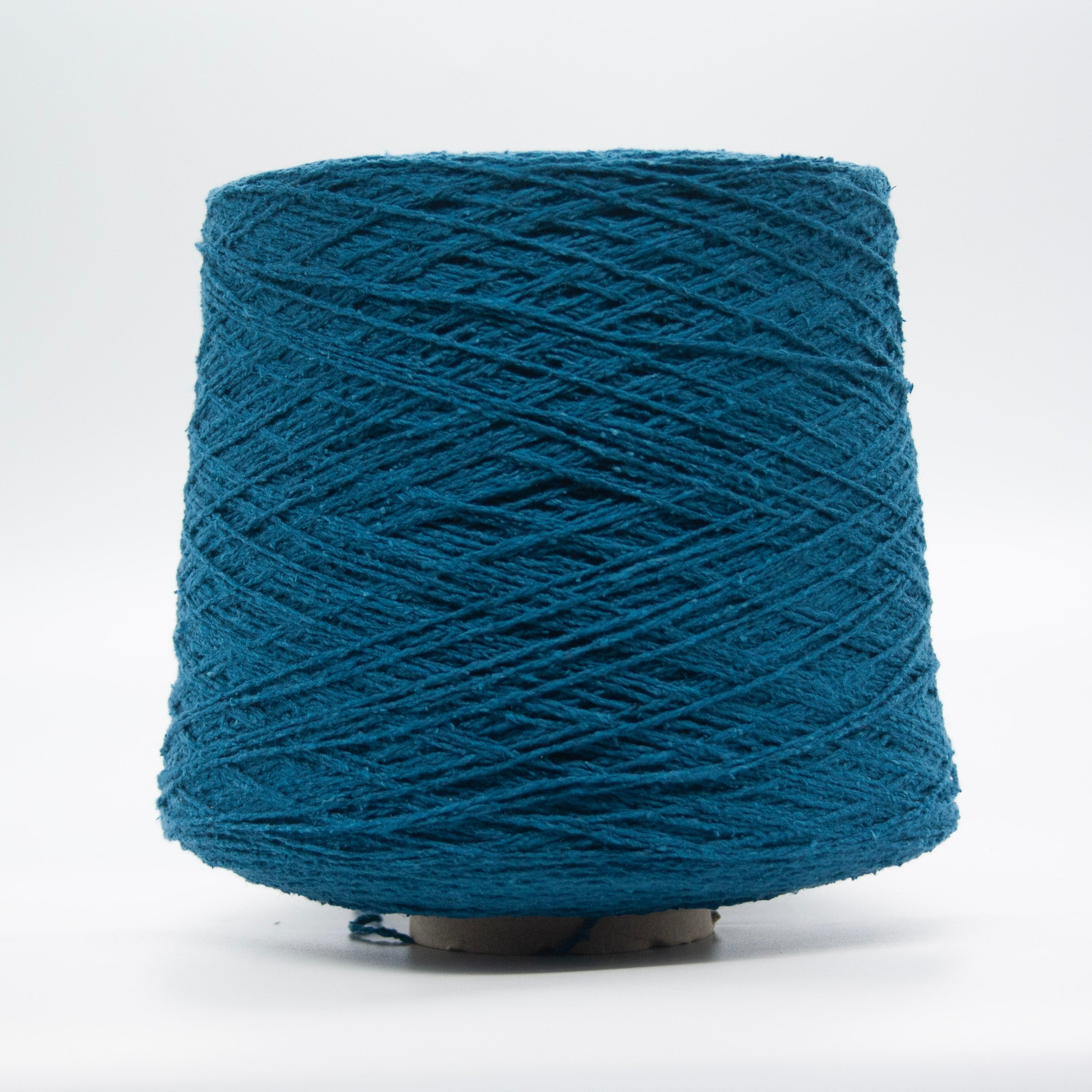 Cone of Seta Bourette yarn in Petrolio Blu by Filati Venezia