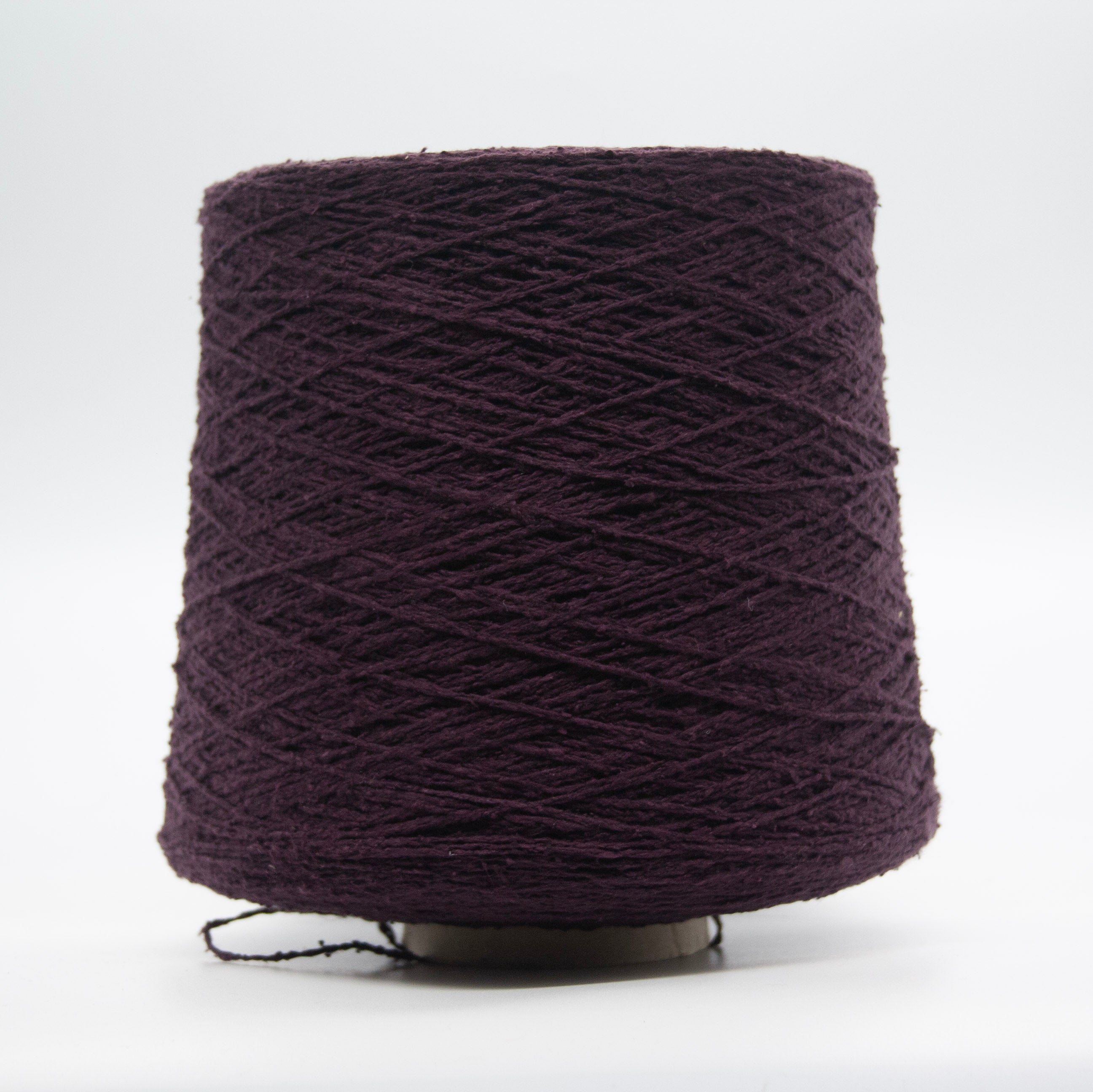 Cone of Seta Bourette yarn in Prugna Scura by Filati Venezia