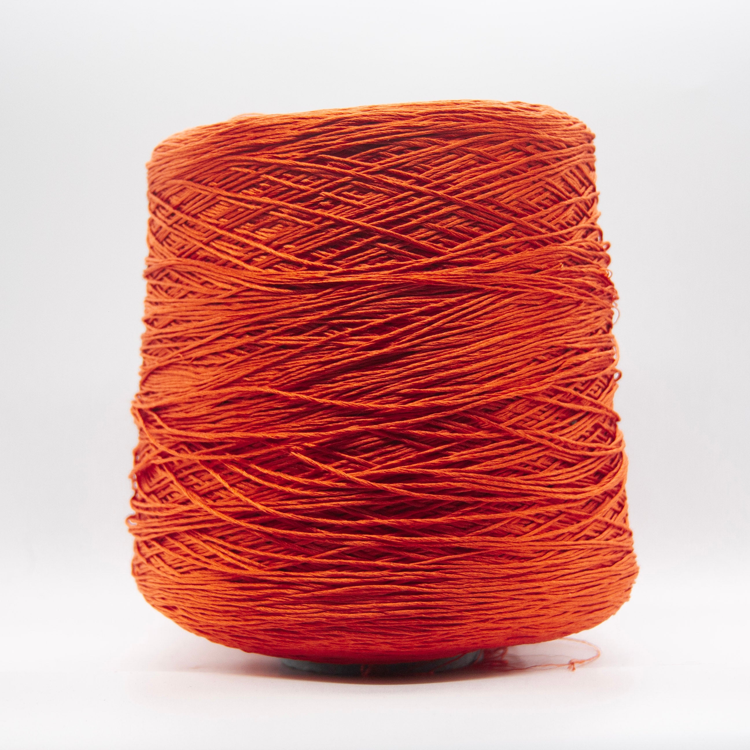 Cone of Seta Schappe yarn in Corallo Vivo by Filati Venezia