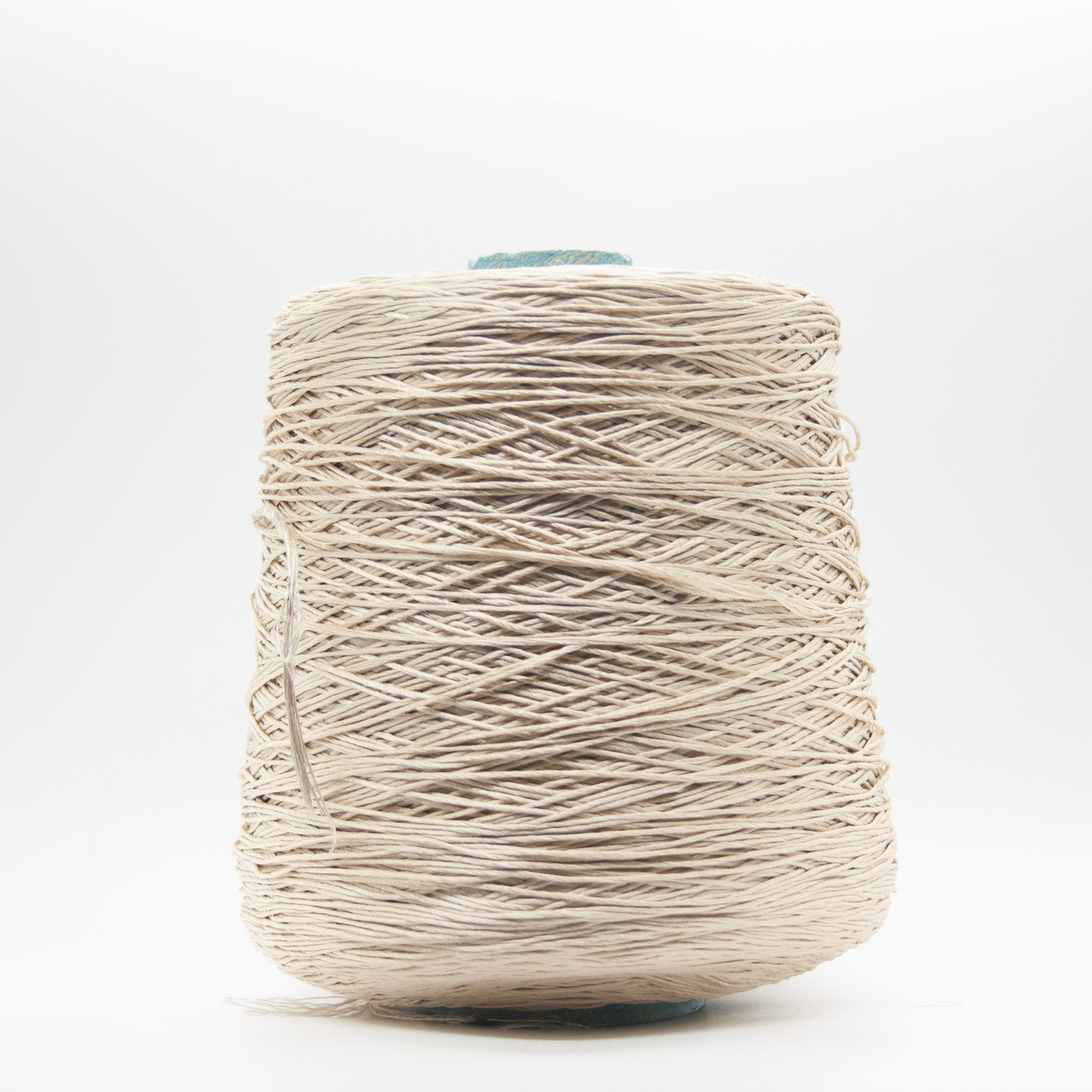 Cone of Seta Schappe yarn in Crema Antica by Filati Venezia