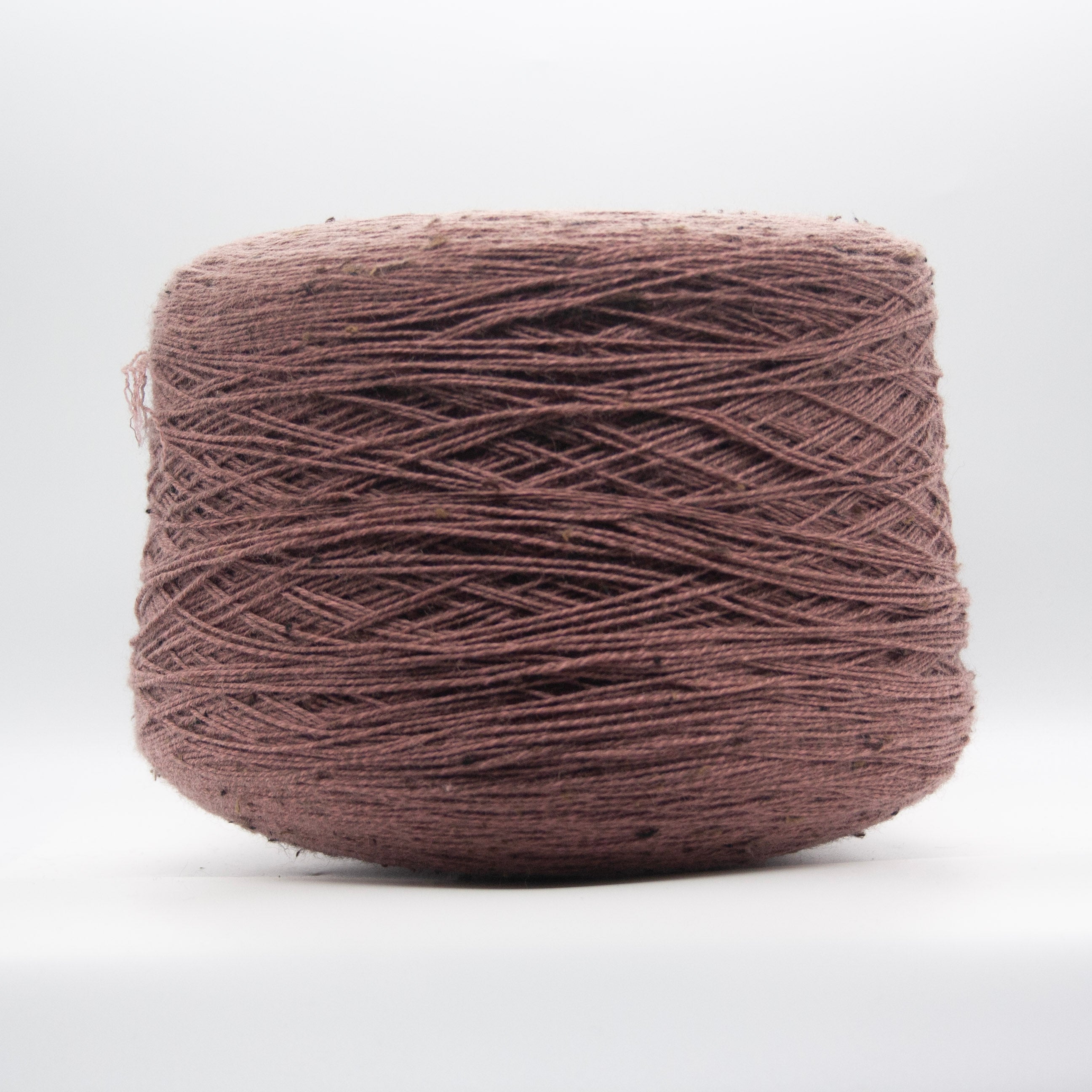 Cone of Slubby Green yarn in Brandy Sniffer by Filati Venezia