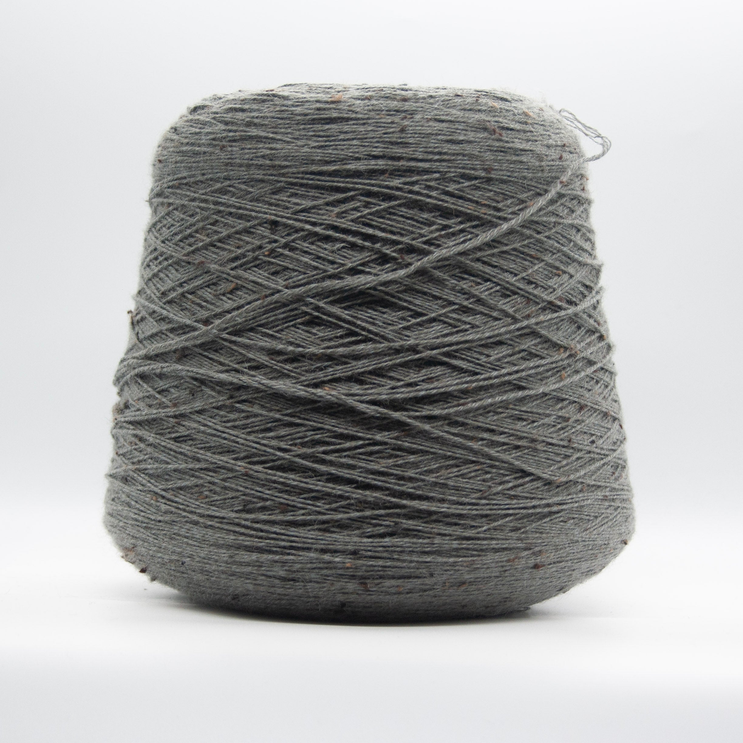 Cone of Slubby Green yarn in Neutral Grey by Filati Venezia