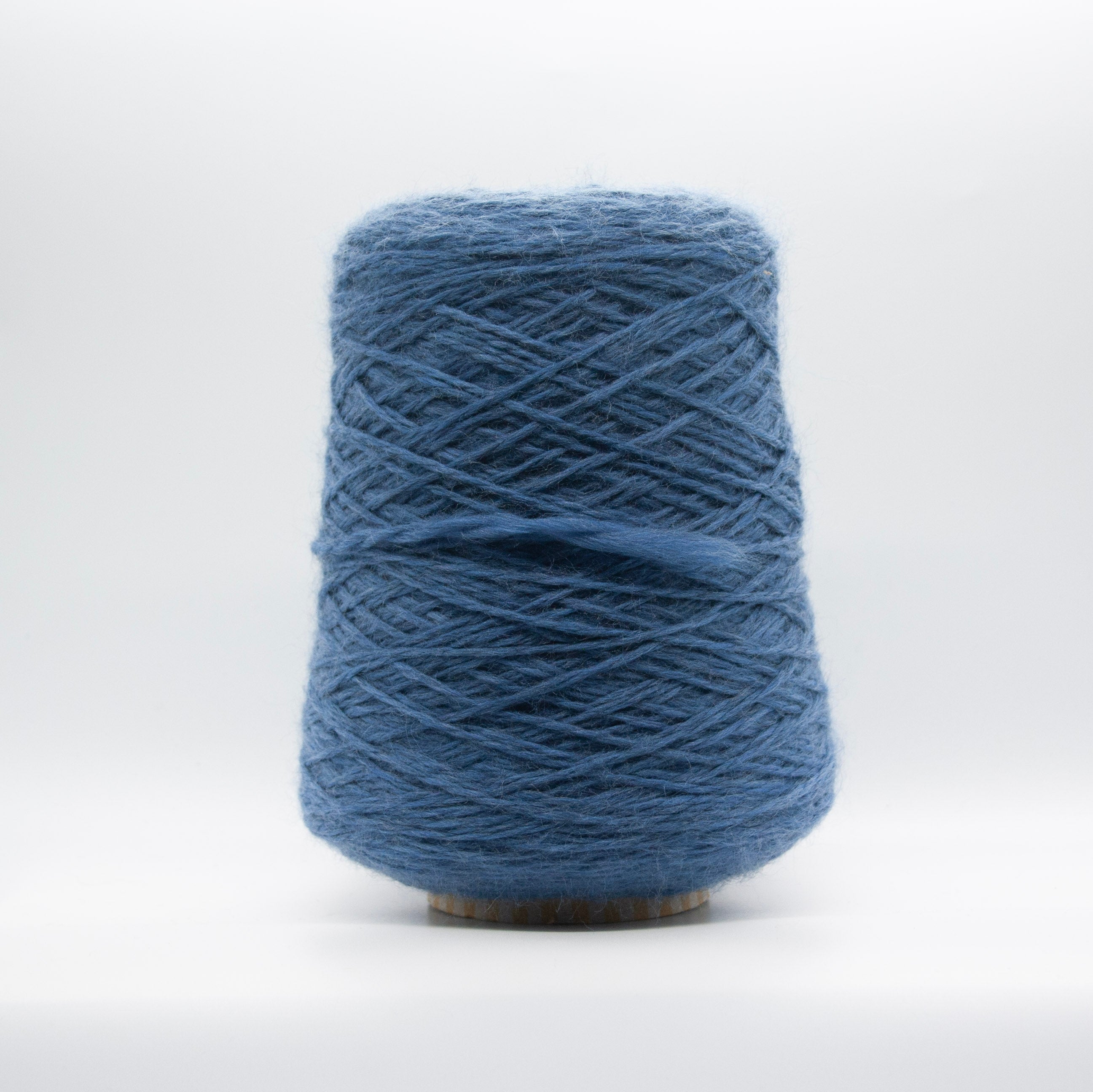 Cone of Sogno yarn in Blue Avio Melange by Filati Venezia