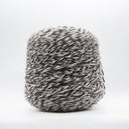 Cone of Sogno yarn in Mouline Cow by Filati Venezia