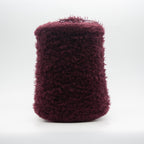 Cone of Tagliatino Merino Aran yarn in Melanzana Scura by Filati Venezia