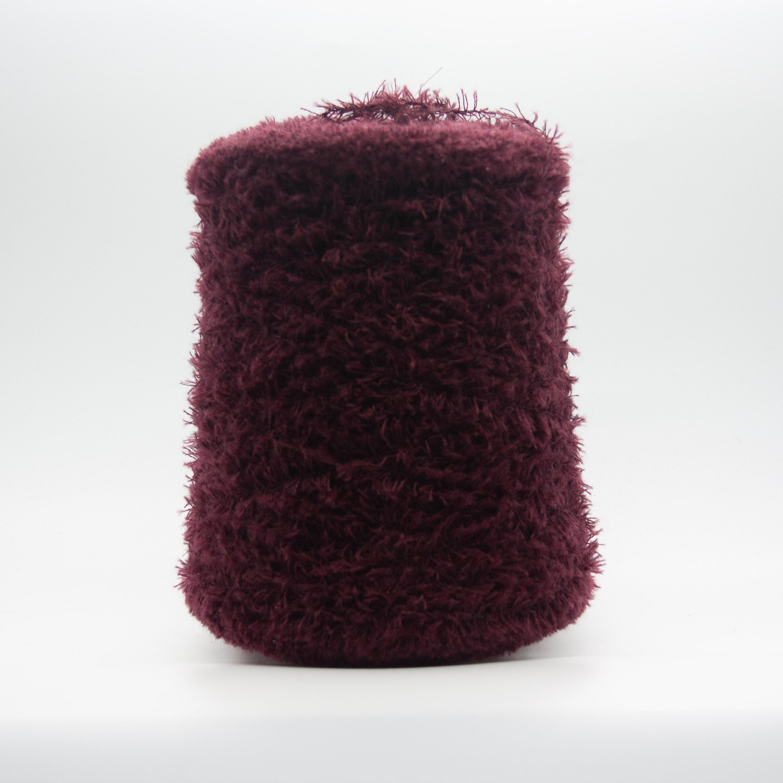 Cone of Tagliatino Merino Aran yarn in Melanzana Scura by Filati Venezia