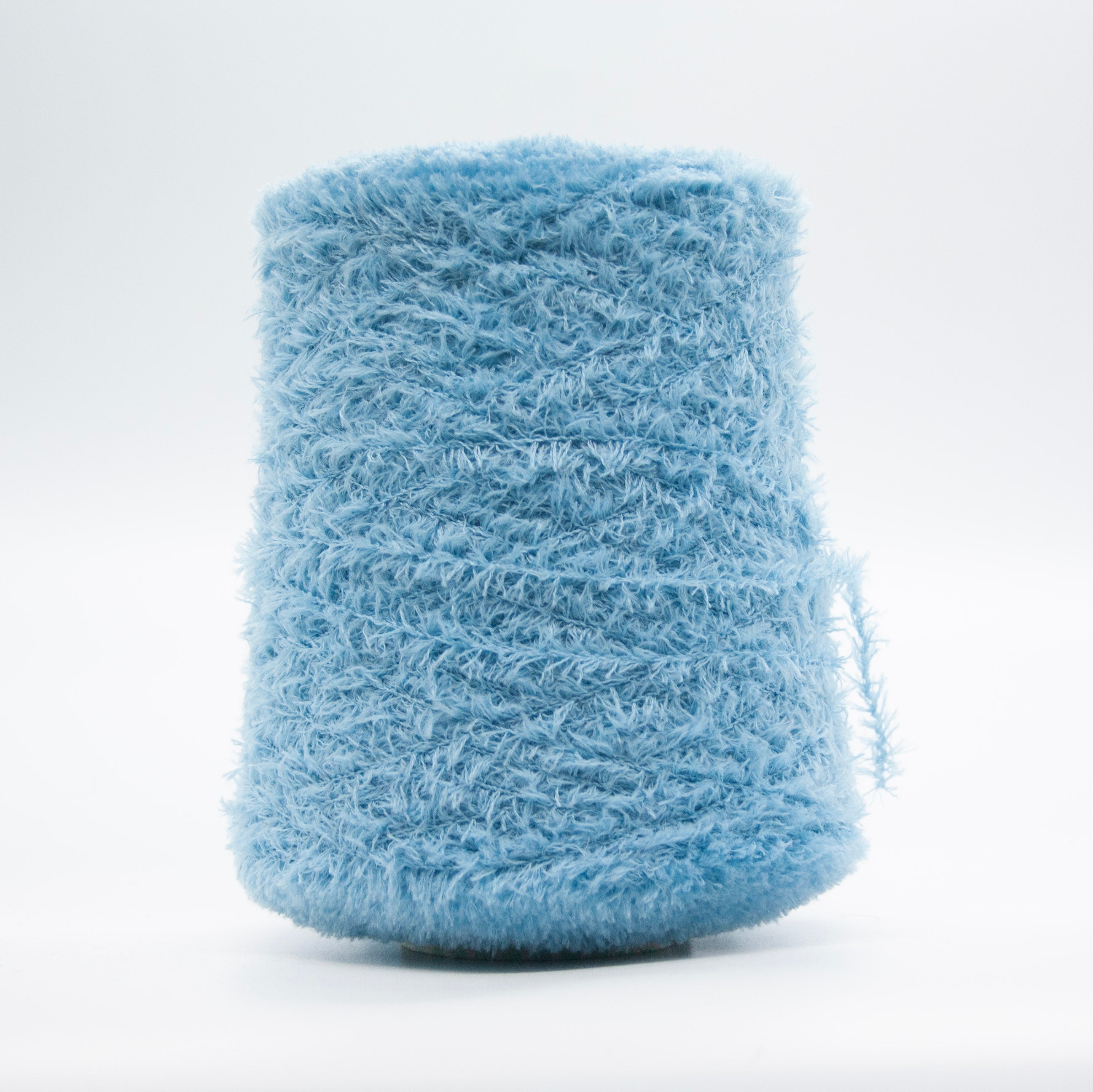 Cone of Tagliatino Merino yarn in Melograno Rosso by Filati Venezia
