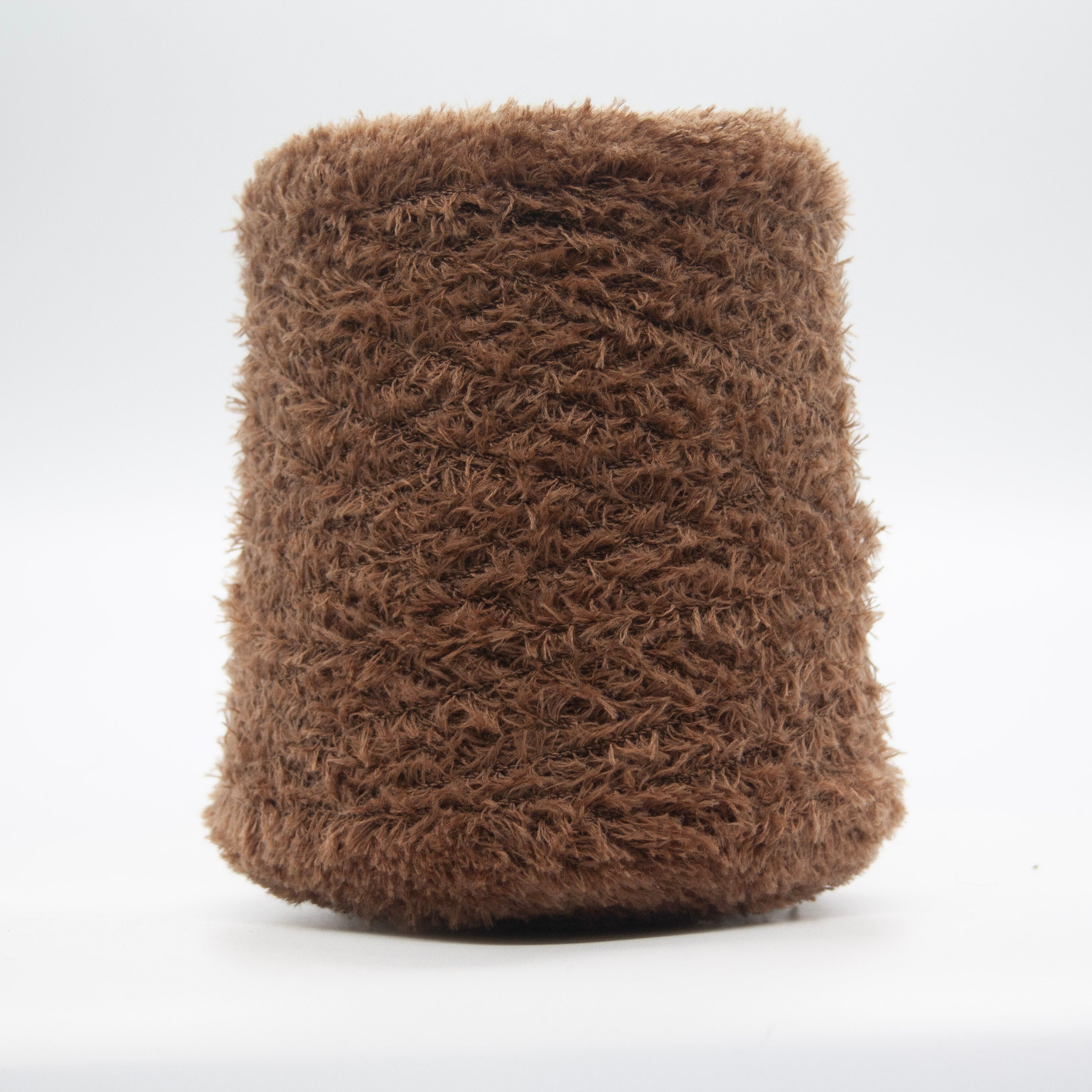 Cone of Tagliatino Merino yarn in Miele Castagna by Filati Venezia