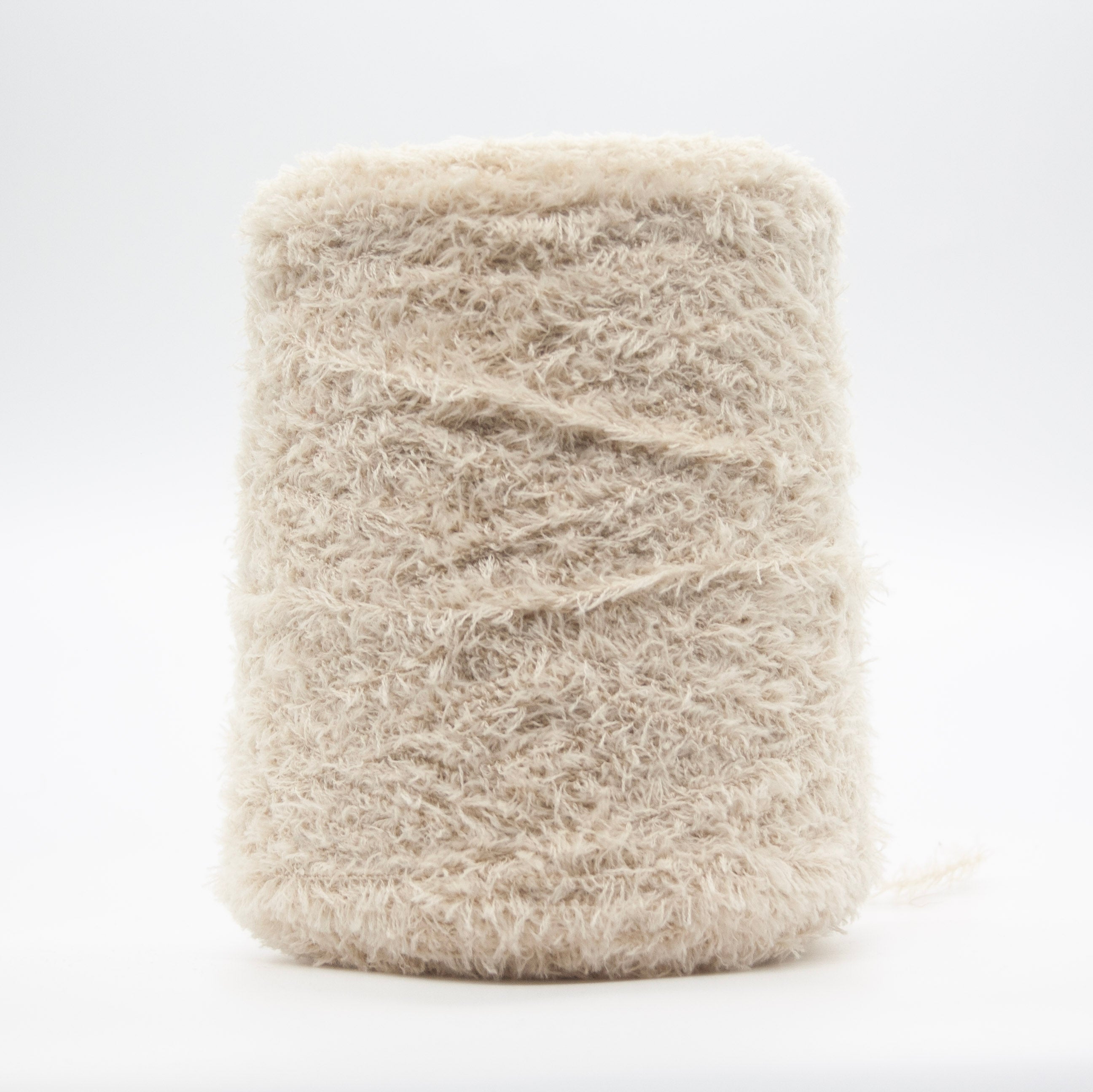 Cone of Tagliatino Merino yarn in Panna Fresca by Filati Venezia