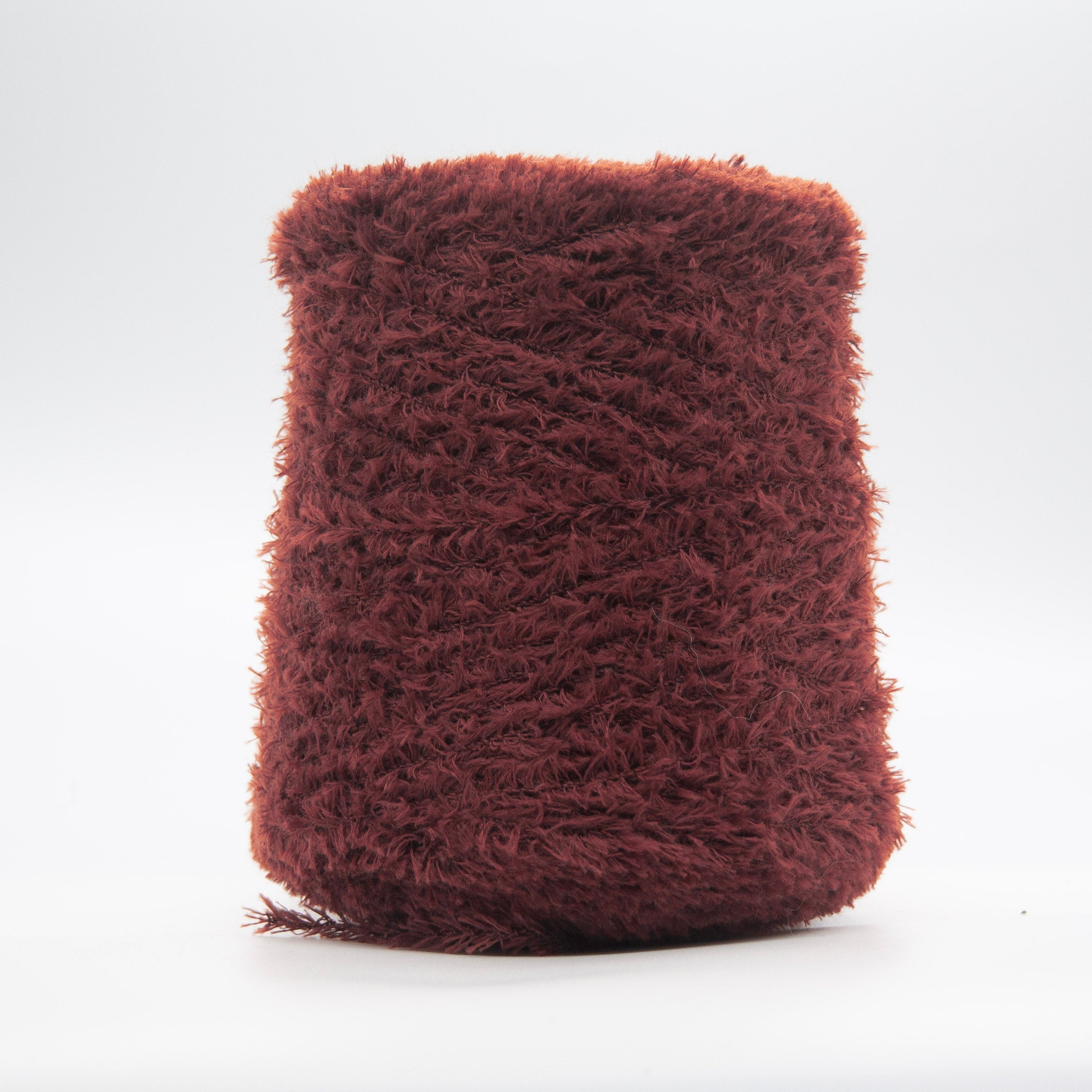 Cone of Tagliatino Merino yarn in Prugna Nero by Filati Venezia