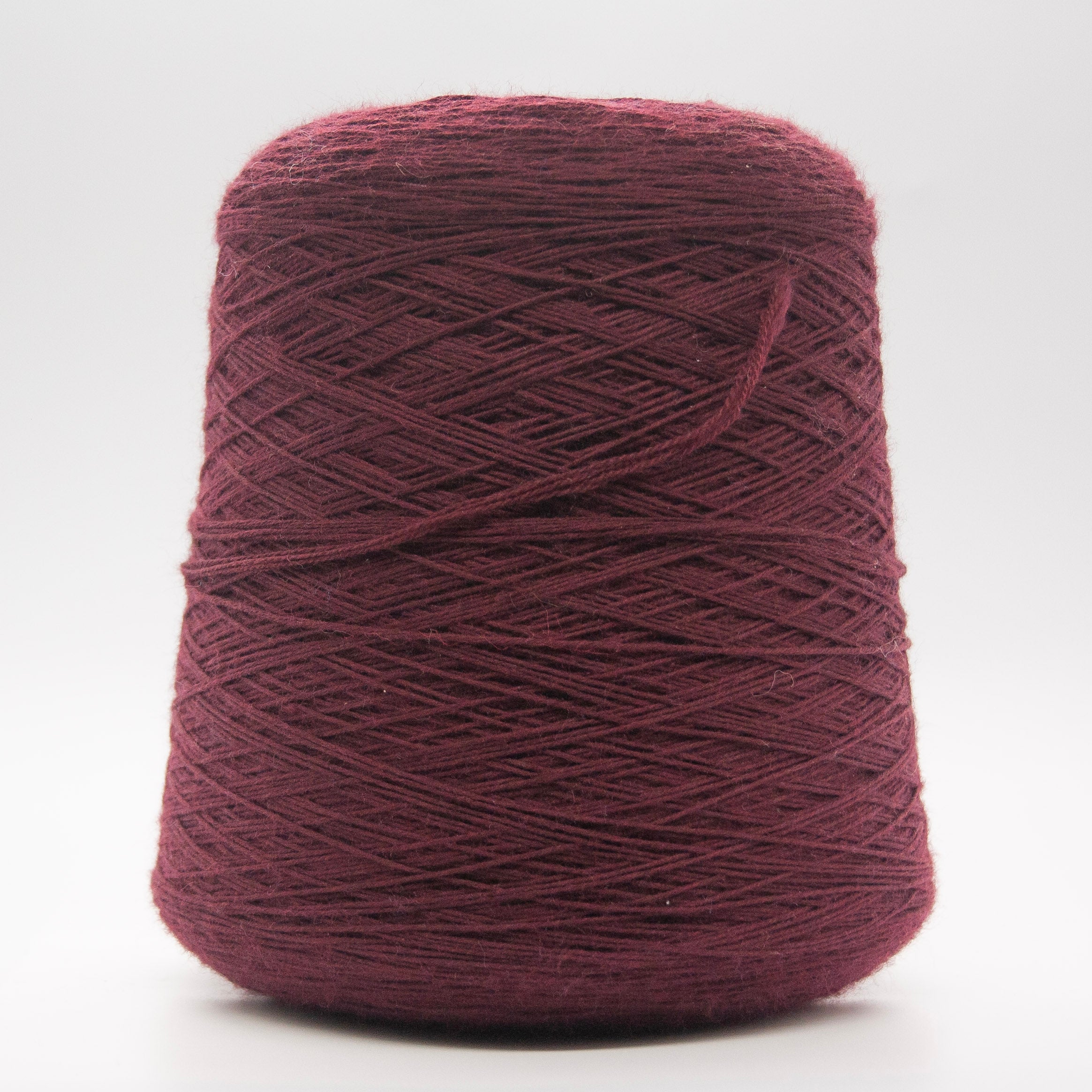 Cone of Victoria Merino yarn in Amarena Profondo by Filati Venezia